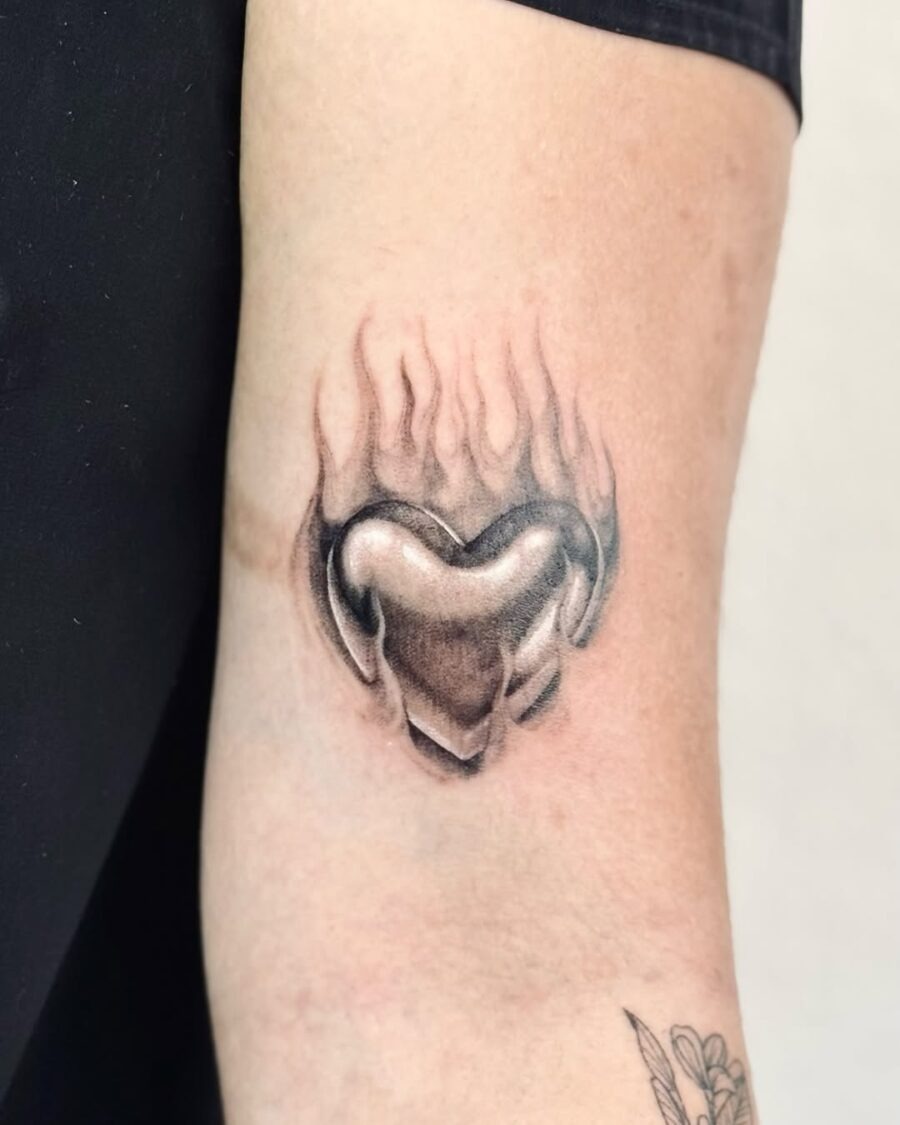 Elegant heart tattoo with flames design Tattoo Design