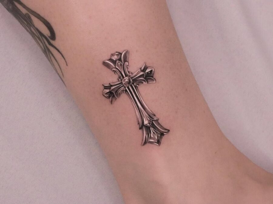 Elegant silver ink cross tattoo on wrist Tattoo Design