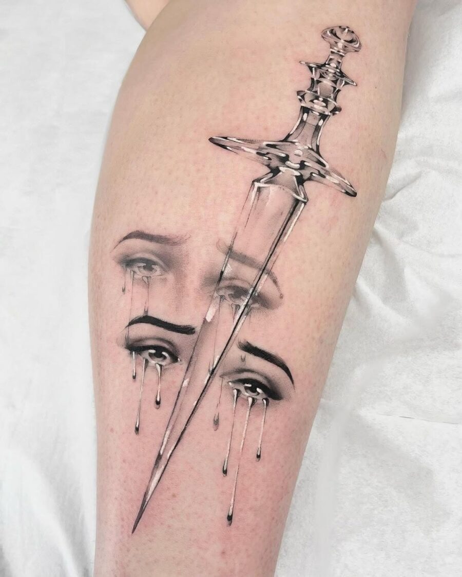 Intricate dagger tattoo with emotional expressions Tattoo Design