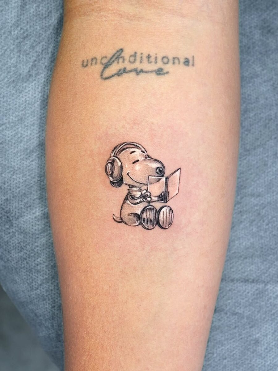 Playful Snoopy in Silver Ink Tattoo Style Tattoo Design