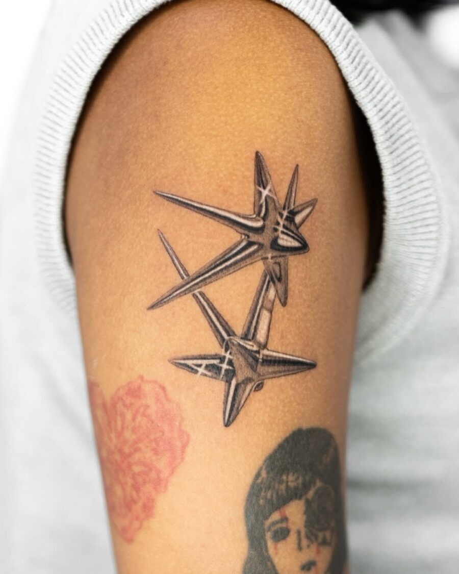 Sharp silver stars tattoo on forearm Tattoo Design