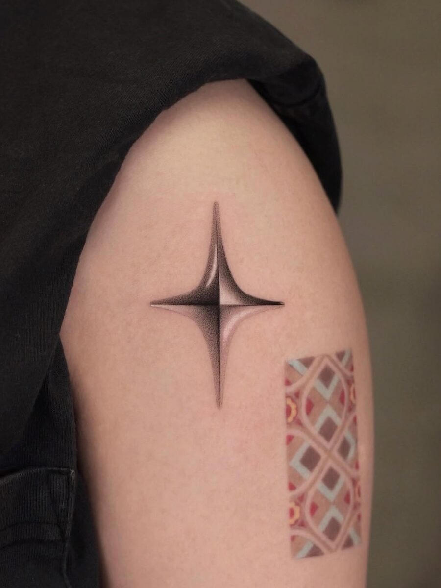 Sleek silver ink star tattoo design Tattoo Design