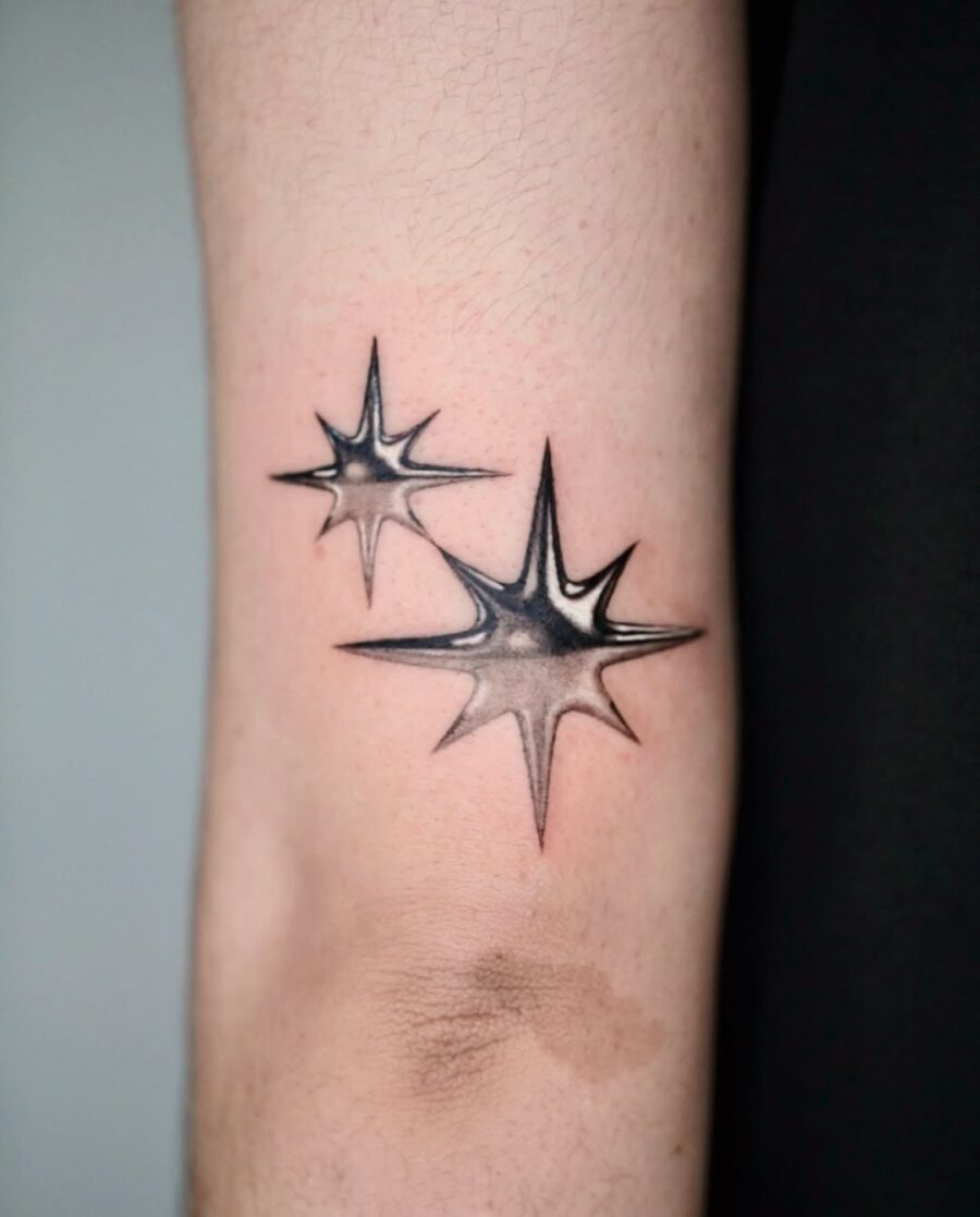 Striking Silver Ink Starburst Tattoos on Skin Tattoo Design