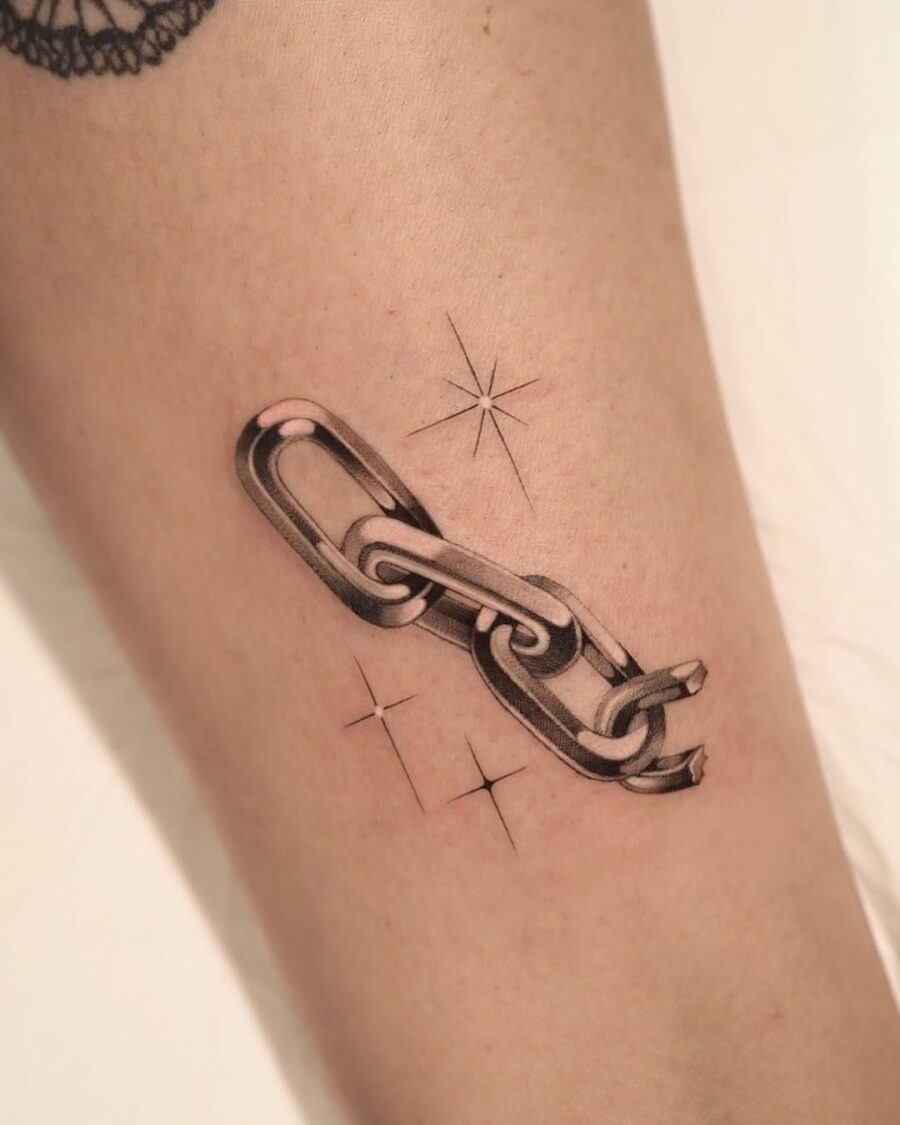 Stylish silver chain tattoo with star accents Tattoo Design