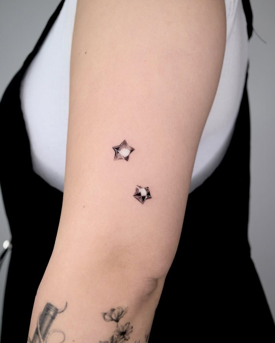 Stylish silver ink stars on skin Tattoo Design