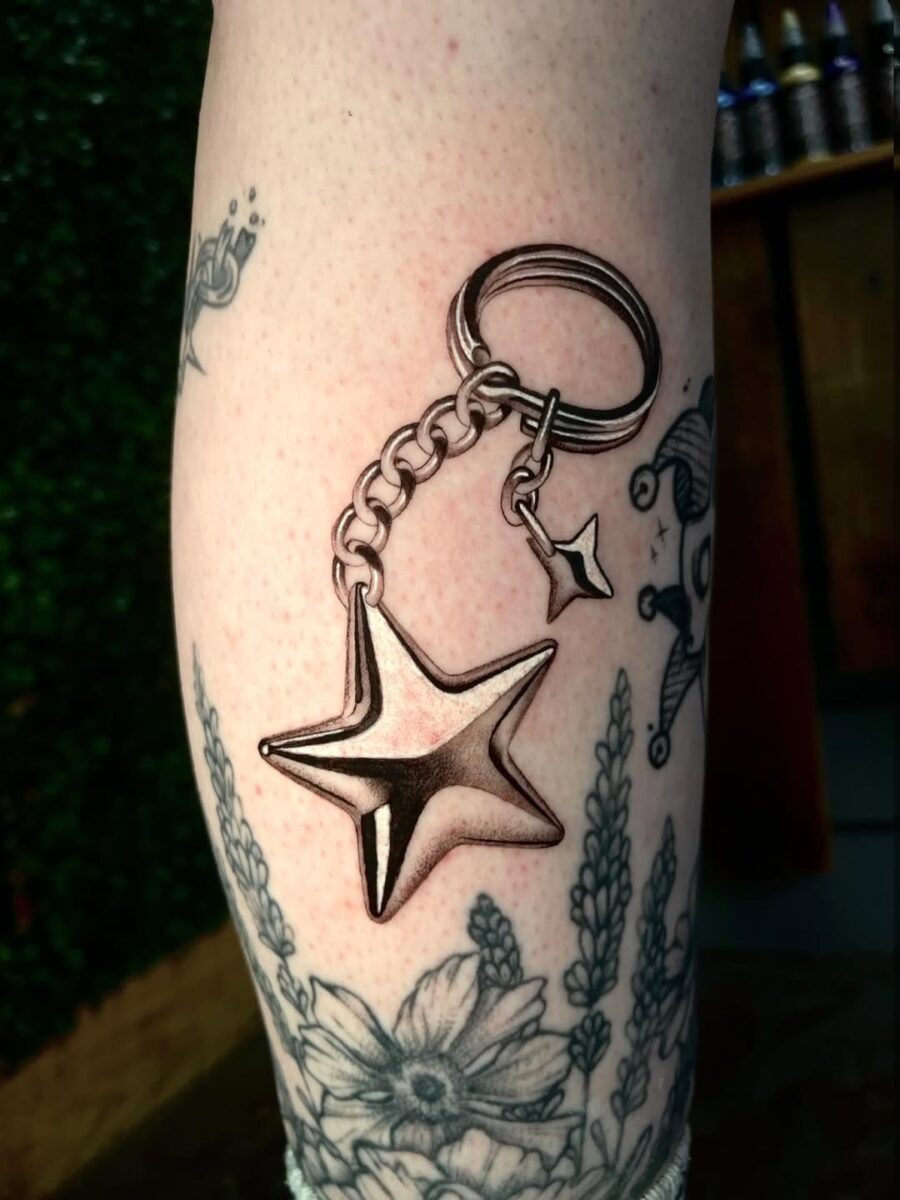 Stylish silver star keychain tattoo design Tattoo Design