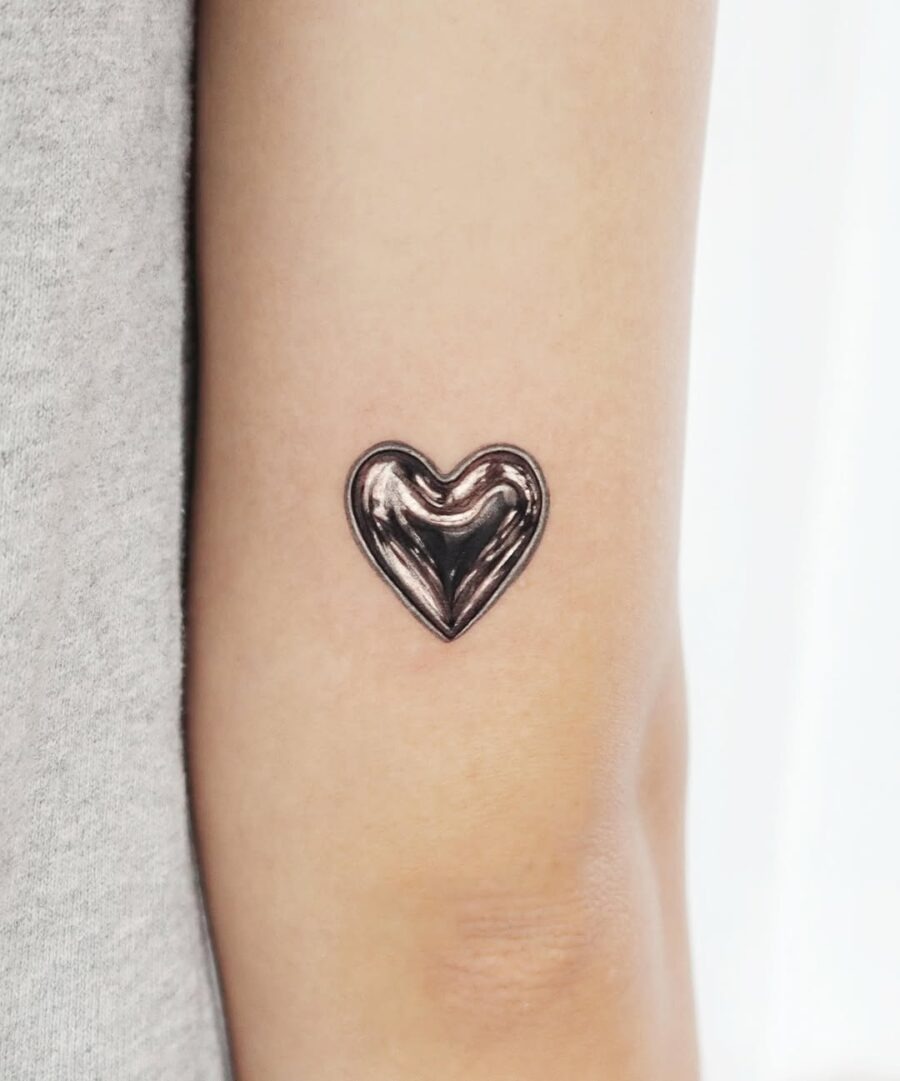 Unique Heart Tattoo in Shiny Silver Ink Tattoo Design