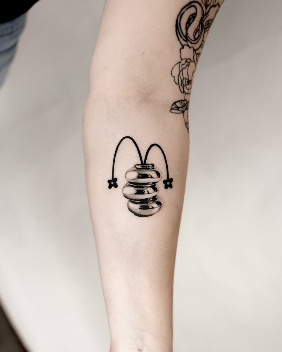 Unique silver ink bouncing design tattoo. Tattoo Design