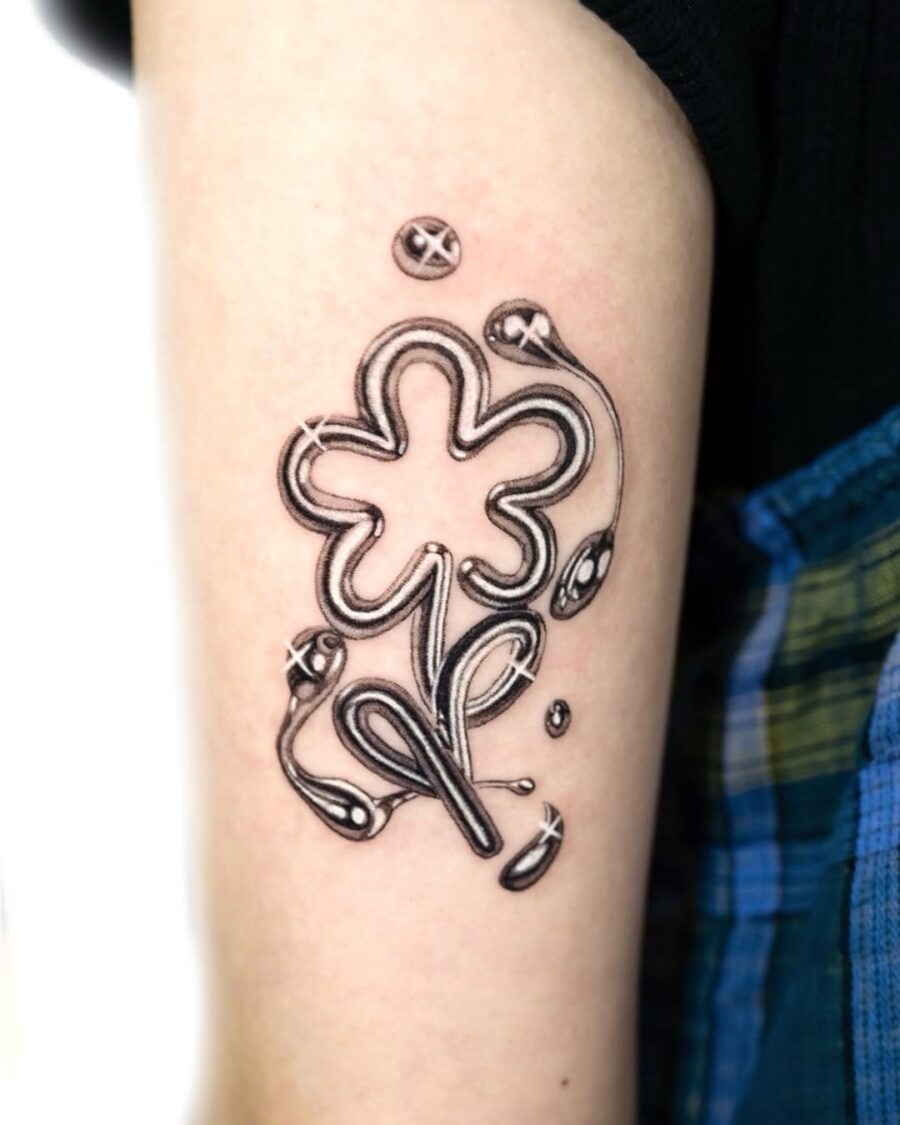 Unique silver ink flower tattoo design Tattoo Design
