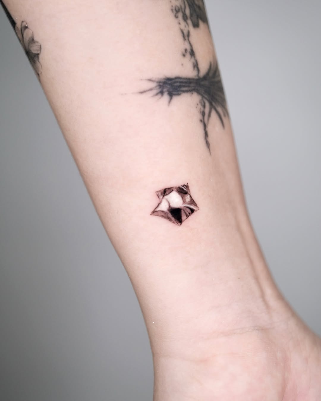 Unique silver ink star tattoo design Tattoo Design
