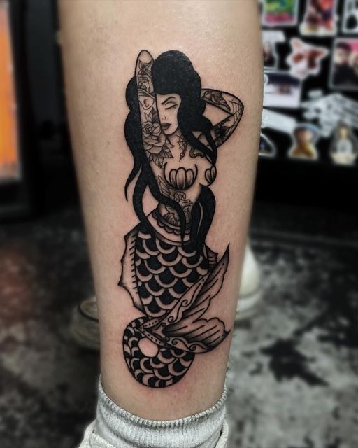 Dark Ornamental Siren with Tattooed Skin, a tattoo design rendered in clean detailed linework.