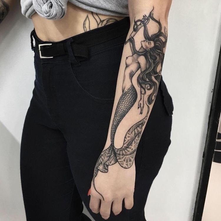 Minimalist Siren in Flowing Black Silhouette, a tattoo design rendered in clean detailed linework for the leg.