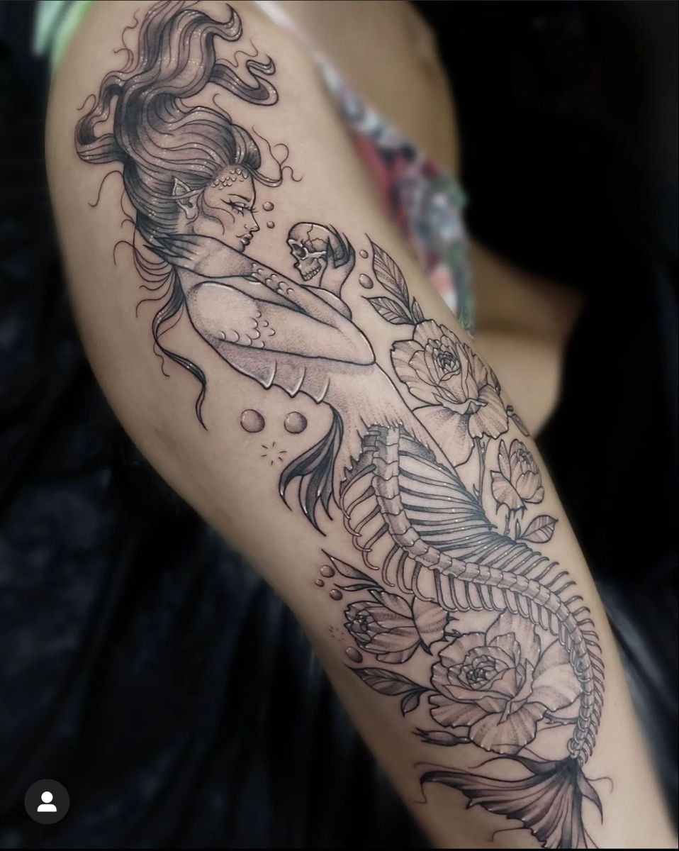Skeletal Siren with Floral Details, a tattoo design rendered in delicate fine-line.