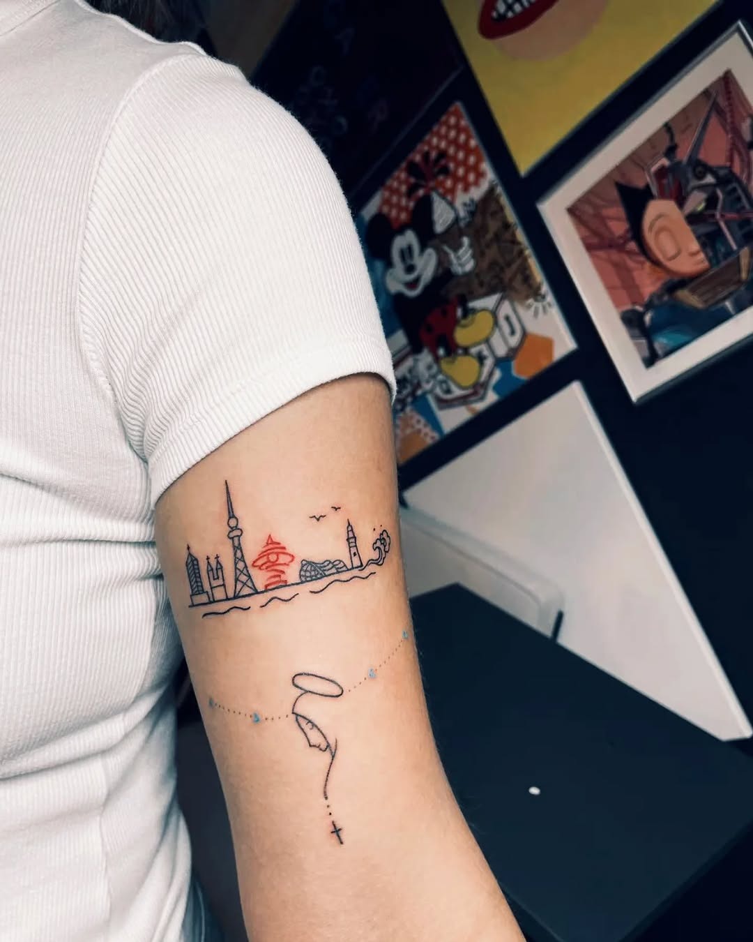 Artistic skyline tattoo with vibrant elements Tattoo Design
