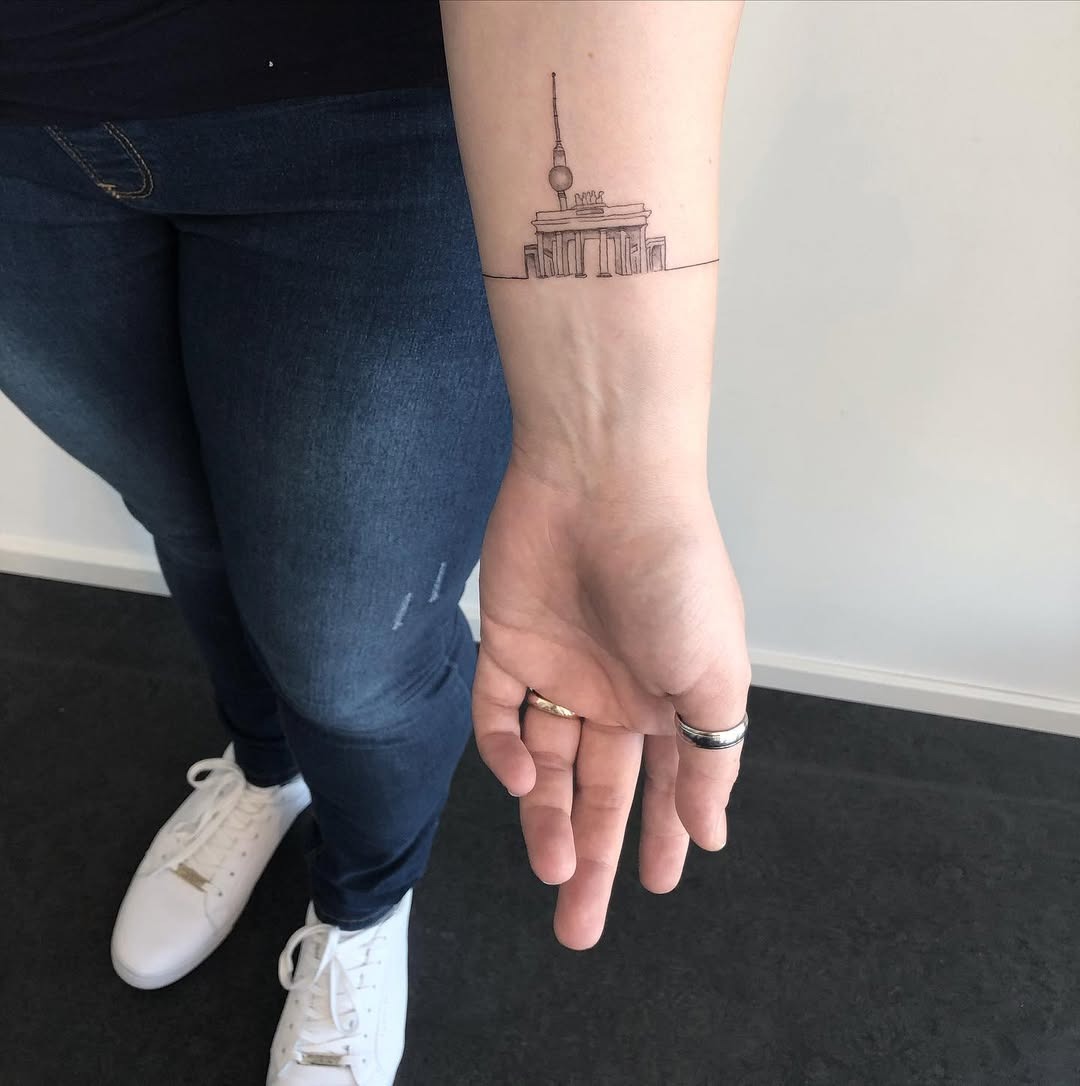 Delicate skyline tattoo featuring an iconic landmark Tattoo Design