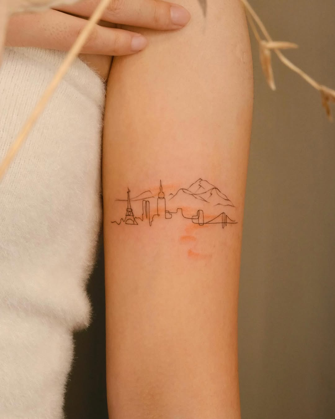 Elegant minimalist skyline tattoo with iconic landmarks Tattoo Design