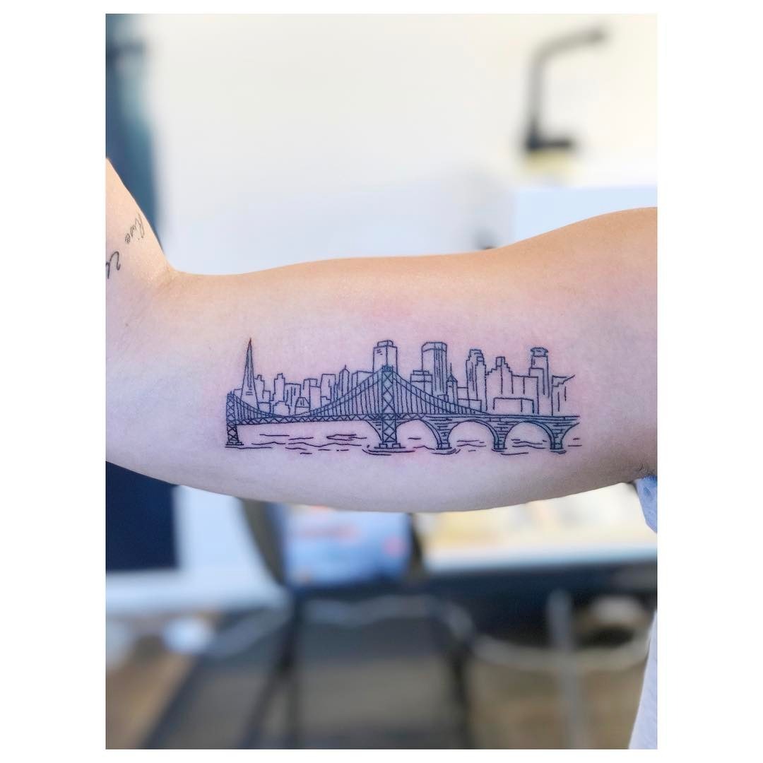 Intricate skyline tattoo featuring city bridges Tattoo Design