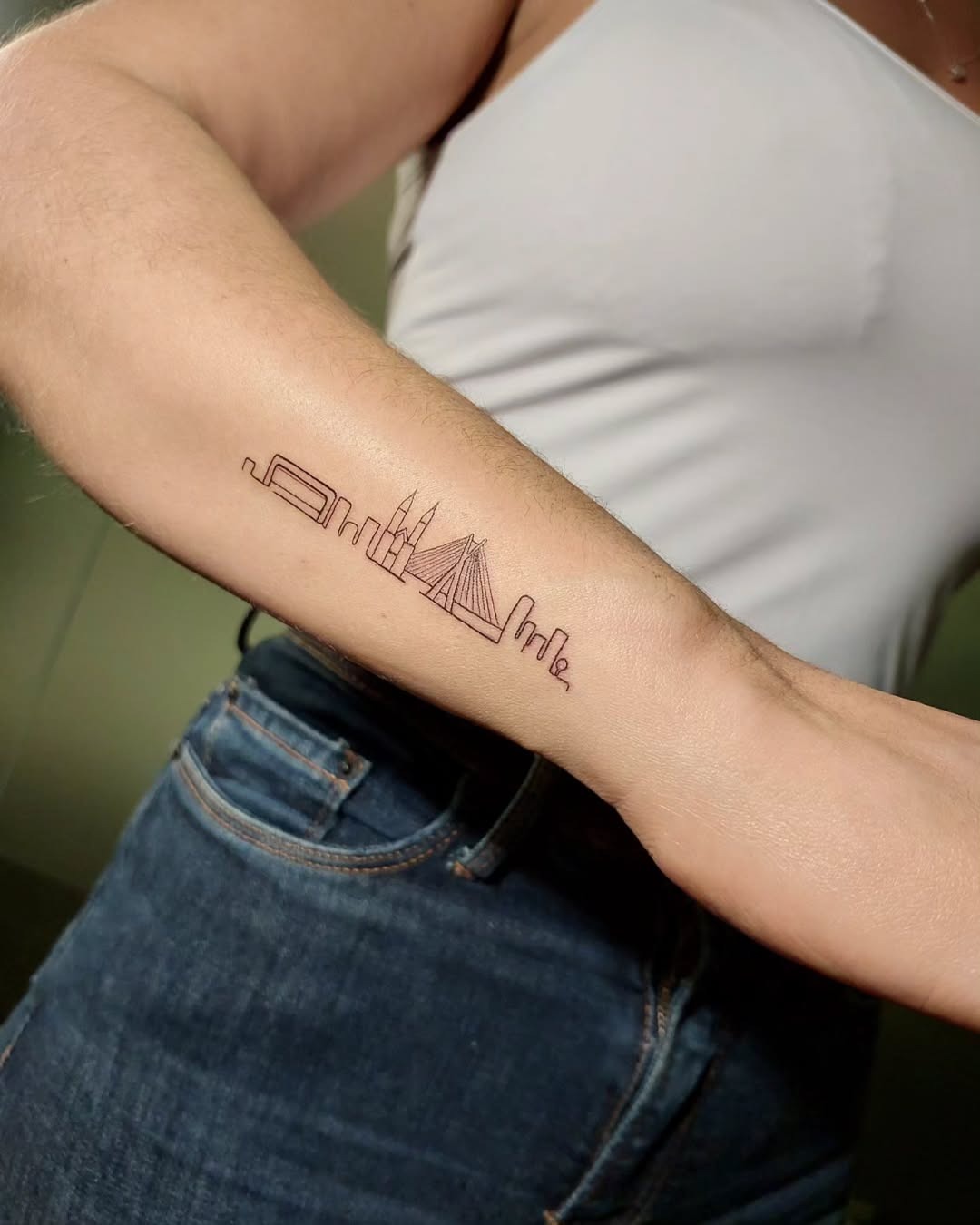 Minimalist skyline tattoo on a forearm Tattoo Design