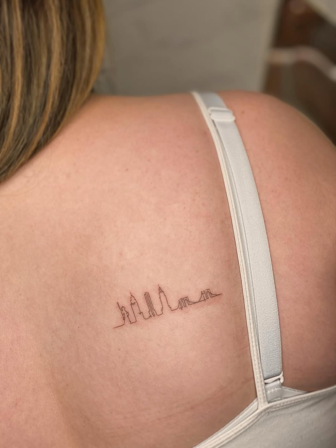 Minimalist skyline tattoo on shoulder Tattoo Design