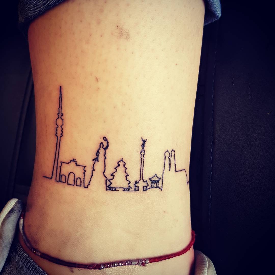Minimalist skyline tattoo with iconic structures Tattoo Design