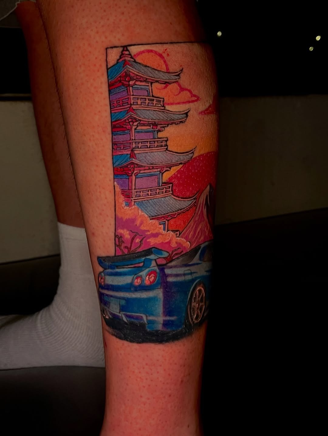 Vibrant skyline tattoo with a car focal point. Tattoo Design