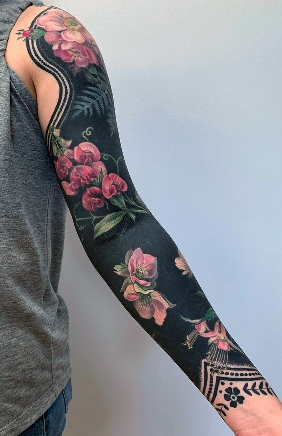 Blackout Floral Sleeve Tattoo with Intricate Border Tattoo Sleeve Tattoo Design