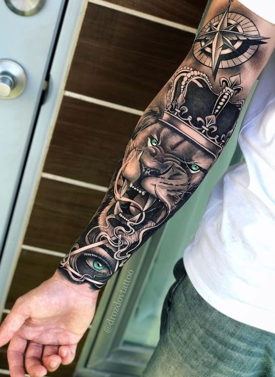 Royal Lion, Compass, and an All-Seeing Eye Sleeve tattoo Tattoo Design