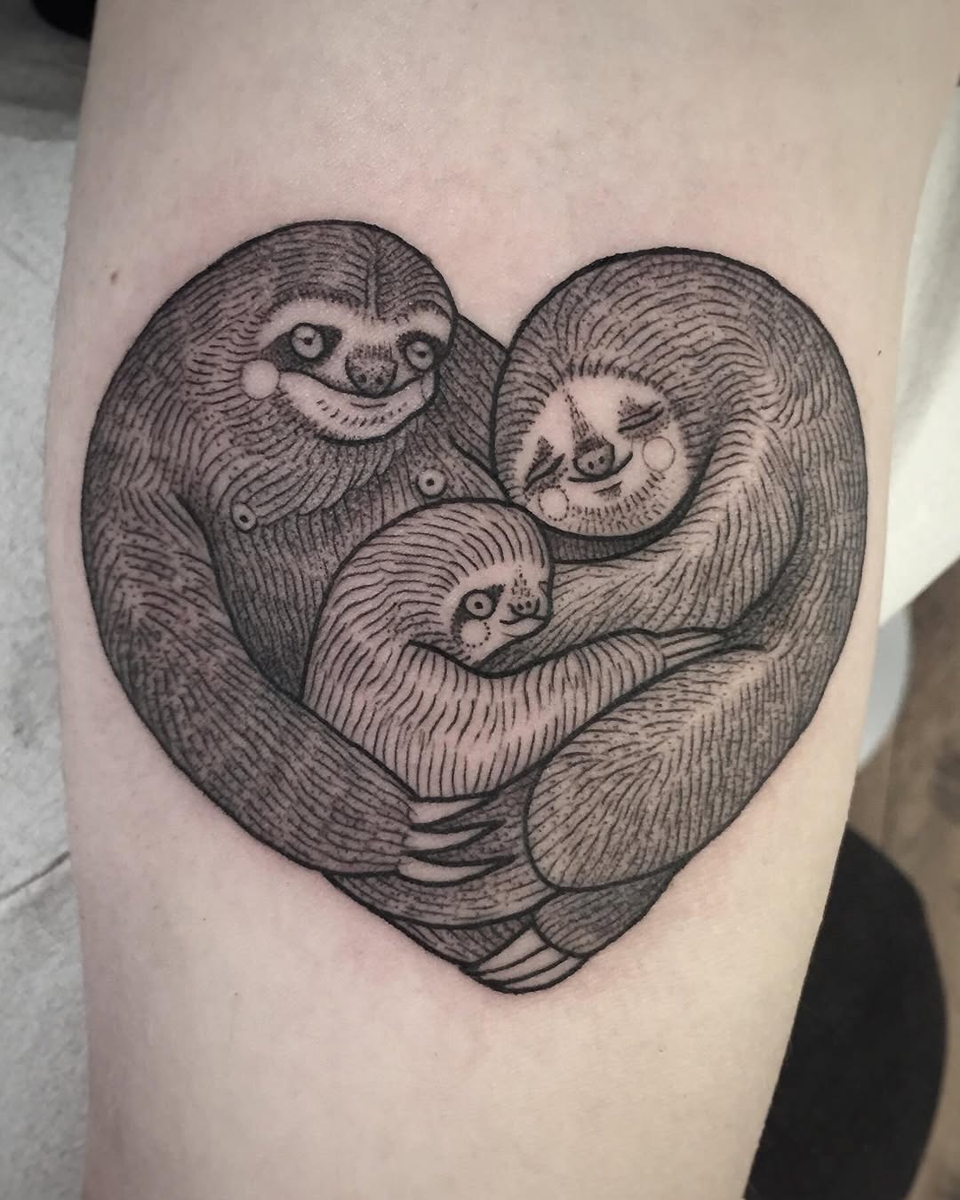 Adorable sloths embrace in a heart design Tattoo Design