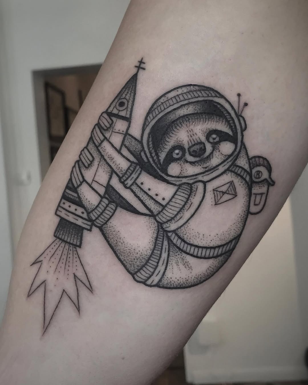 Adventurous sloth in astronaut attire with rocket Tattoo Design