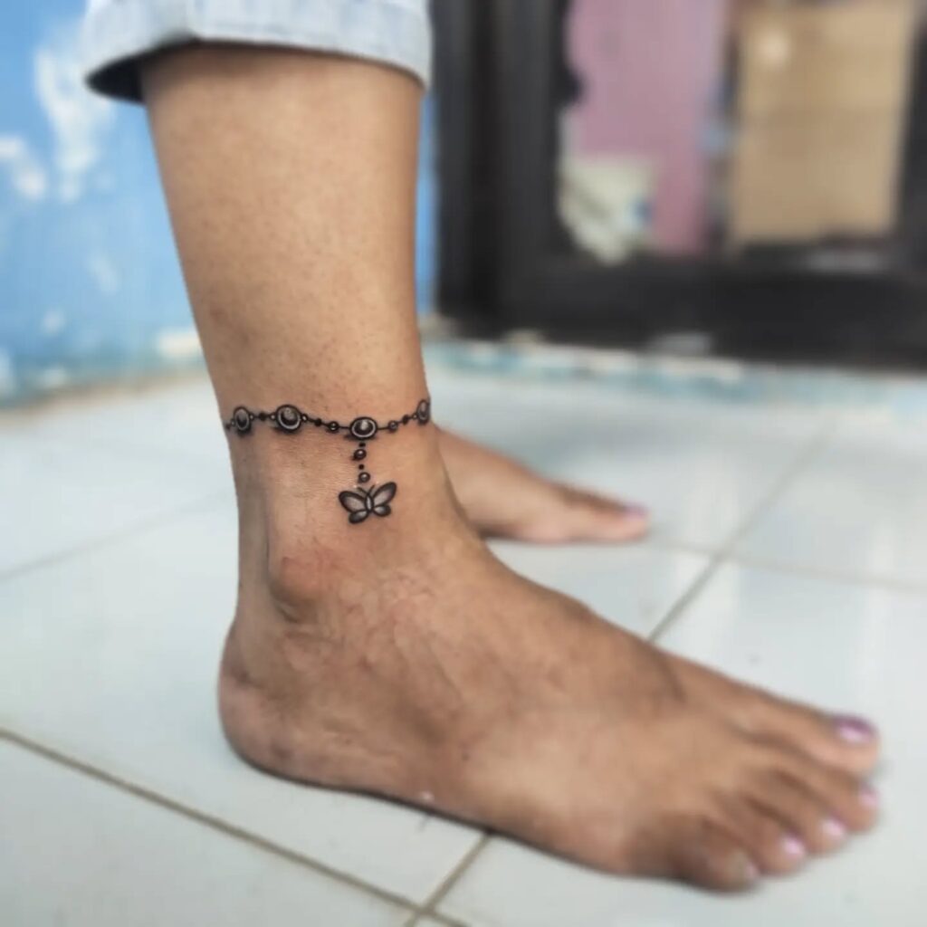 Beaded Anklet Tattoo with Butterfly Charm Tattoo Design