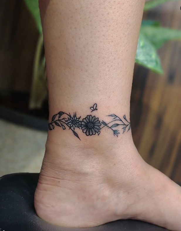 Daisy Chain Anklet Tattoo with Butterfly Tattoo Design