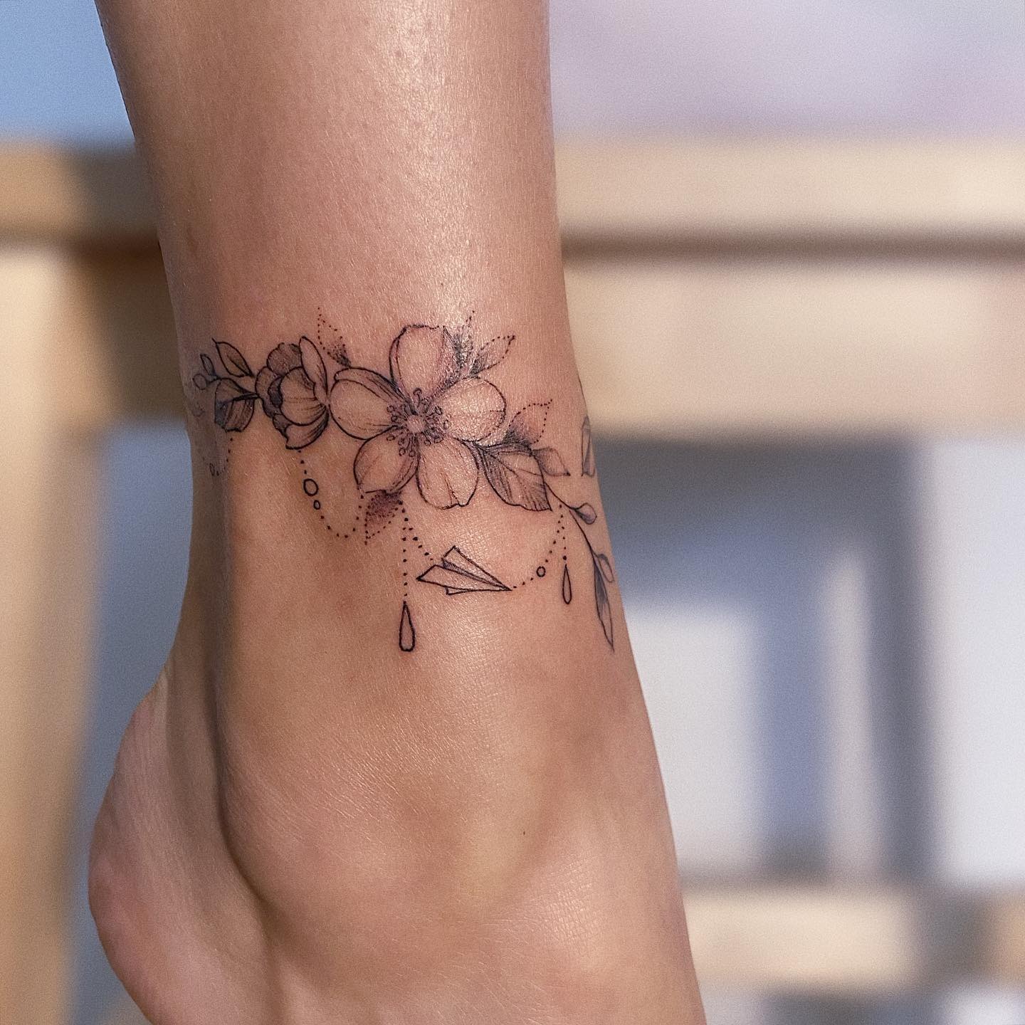 Floral and Paper Plane Ankle Bracelet Tattoo Tattoo Design