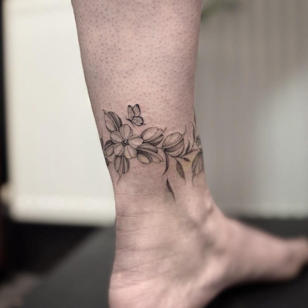 Shaded Floral Ankle Bracelet Tattoo with Butterfly Tattoo Design