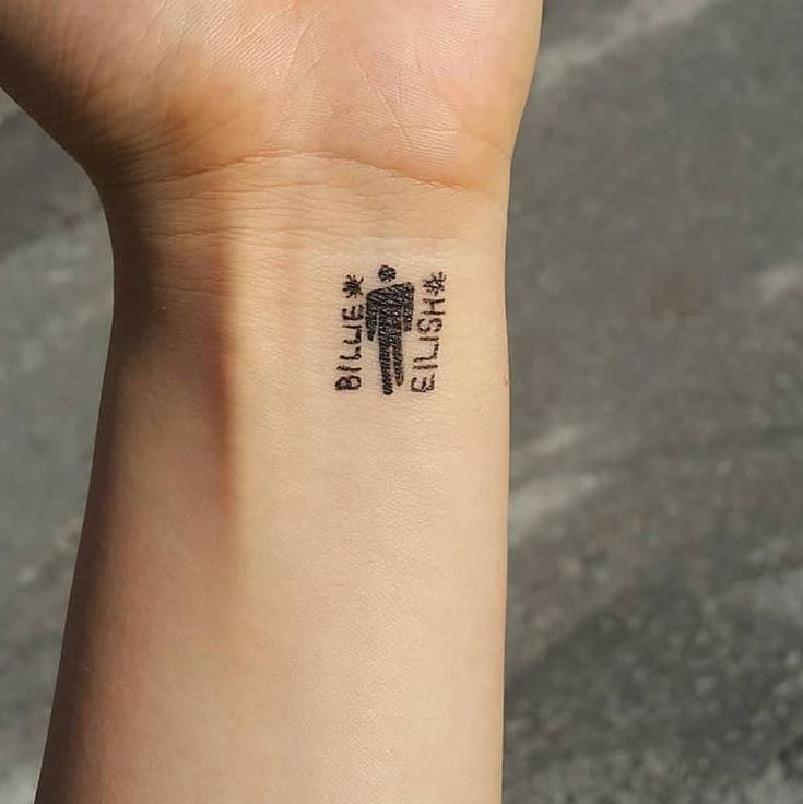 Wrist-Size Devotion: The Classic Blohsh Logo Tattoo Design