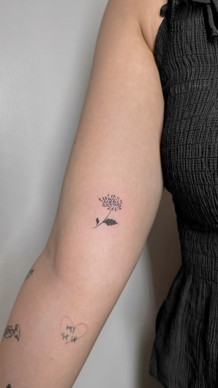 Petite Black Ink Chrysanthemum Tattoo Design