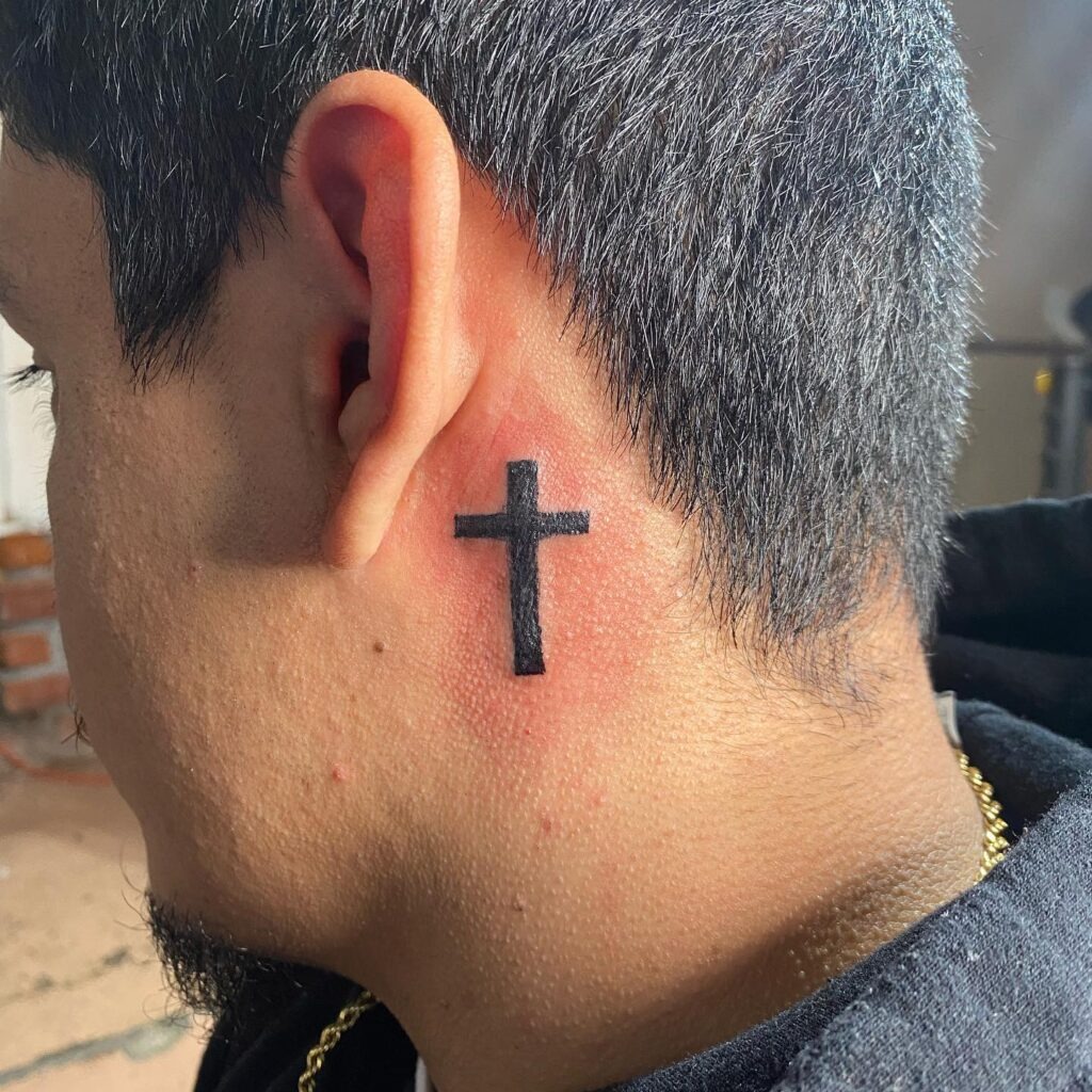 Bold Black Cross Behind Ear Tattoo Tattoo Design