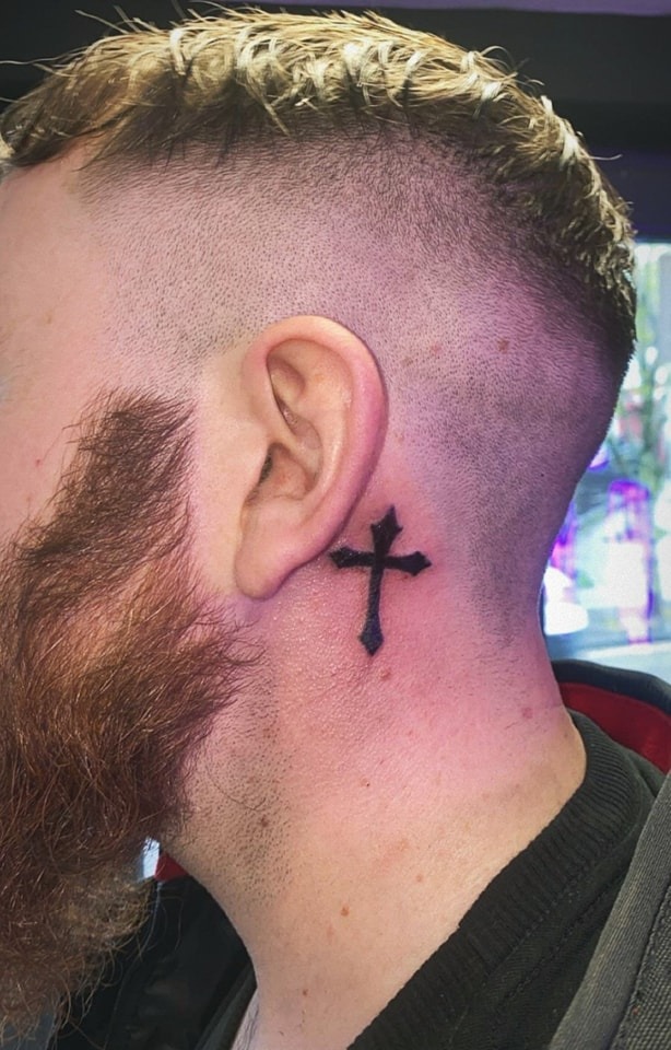 Bold Black Cross Behind the Ear Tattoo Design