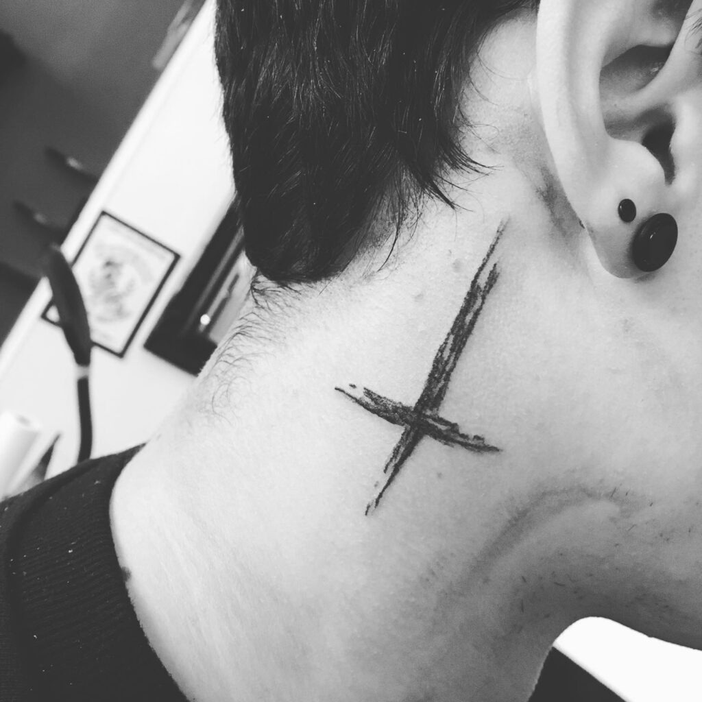 Bold Brushstroke Cross Behind the Ear Tattoo Design