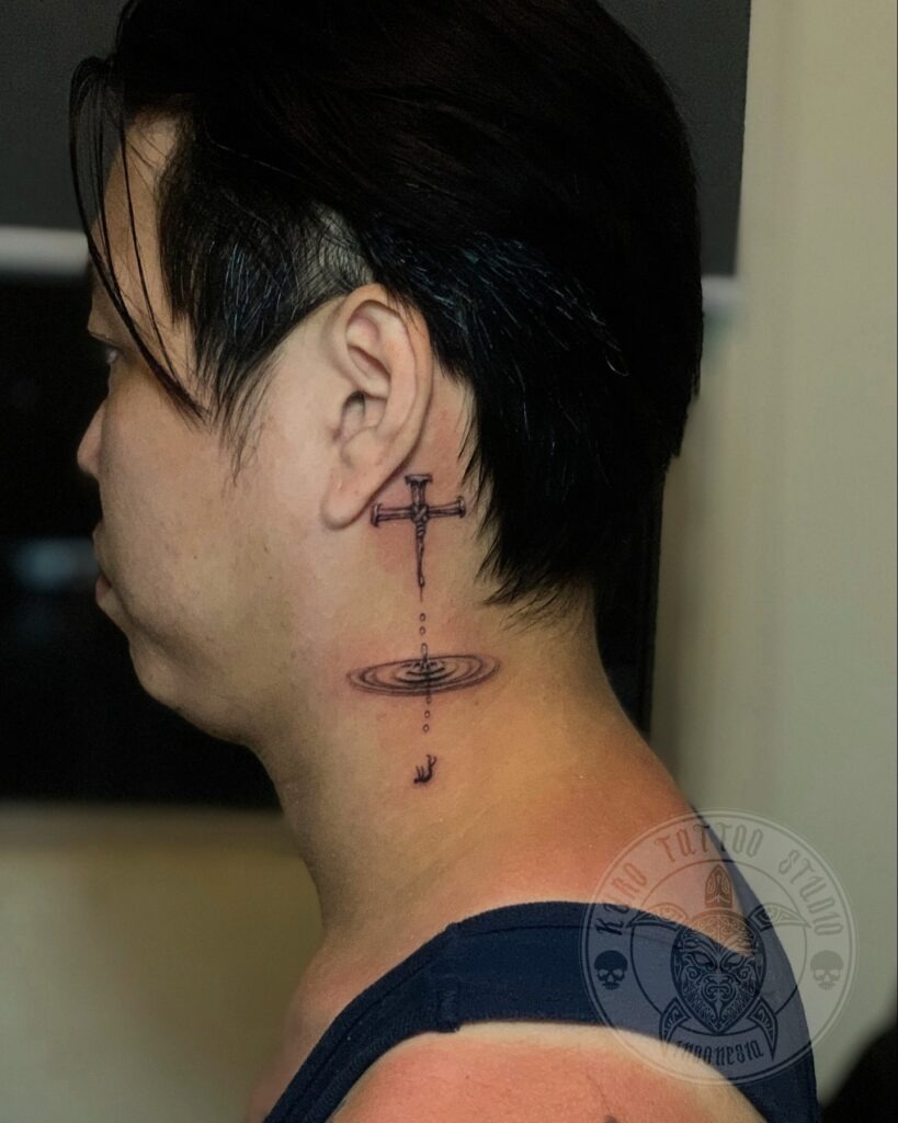Cross with Water Ripple Behind Ear Tattoo Tattoo Design