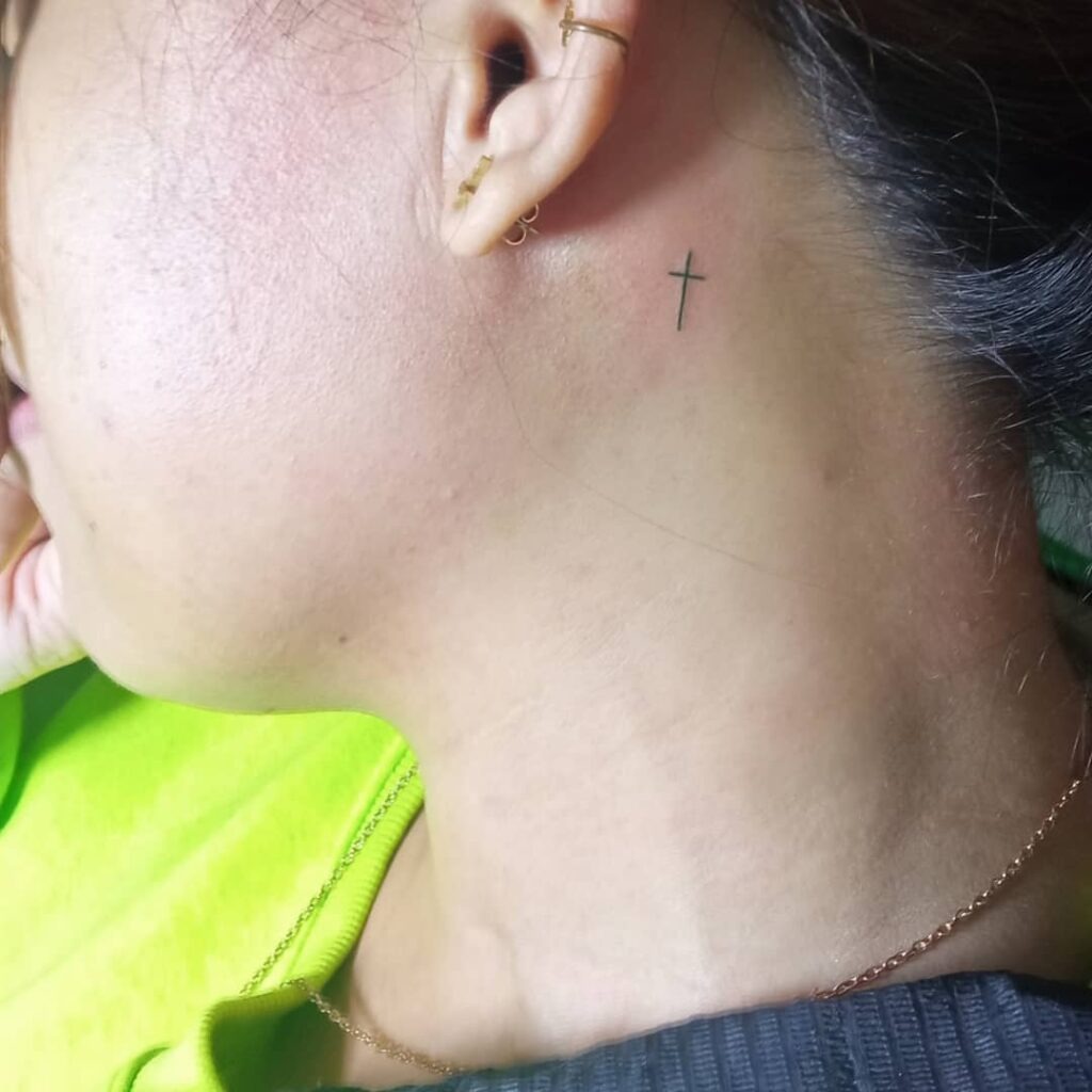 Simple Cross Behind the Ear Tattoo Design
