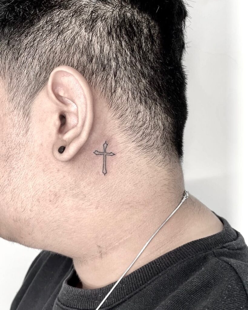 Simple Outlined Cross Behind Ear Tattoo Tattoo Design