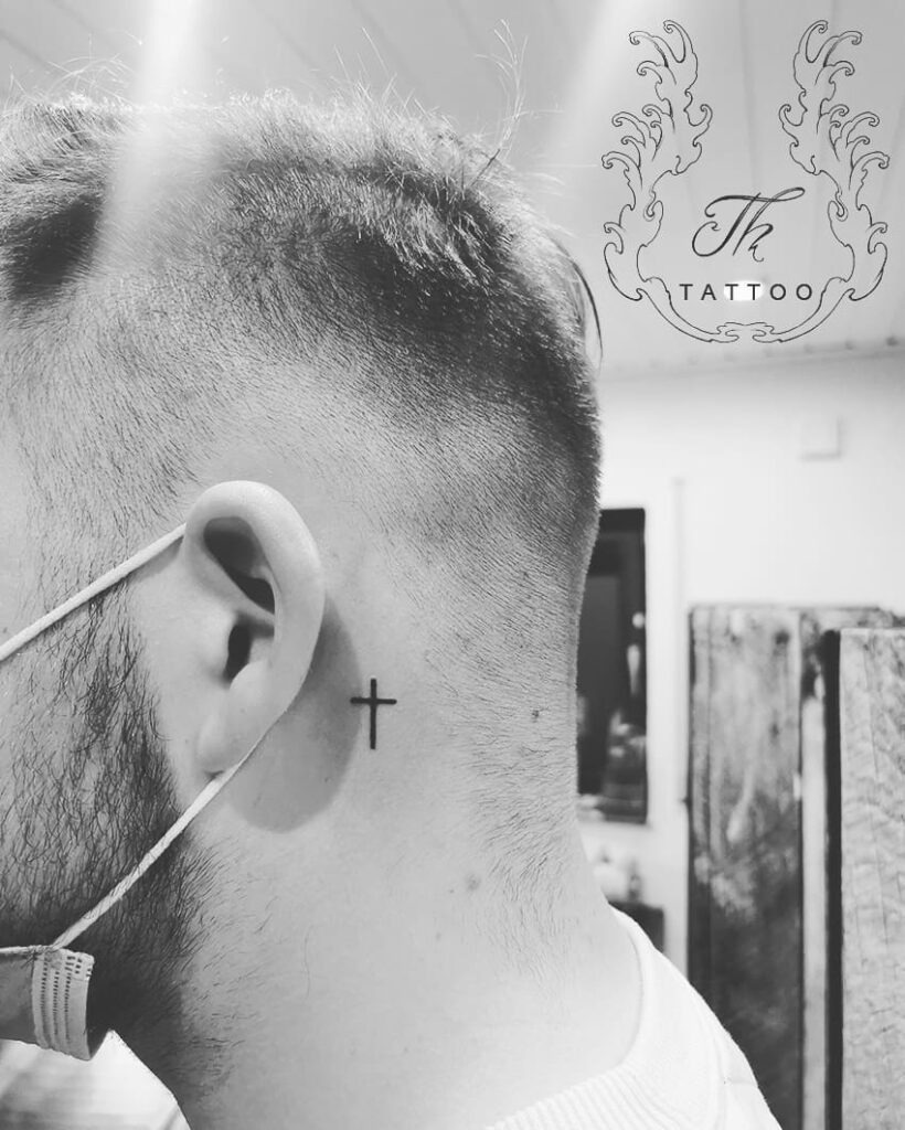 Tiny Black Cross Behind Ear Tattoo Tattoo Design