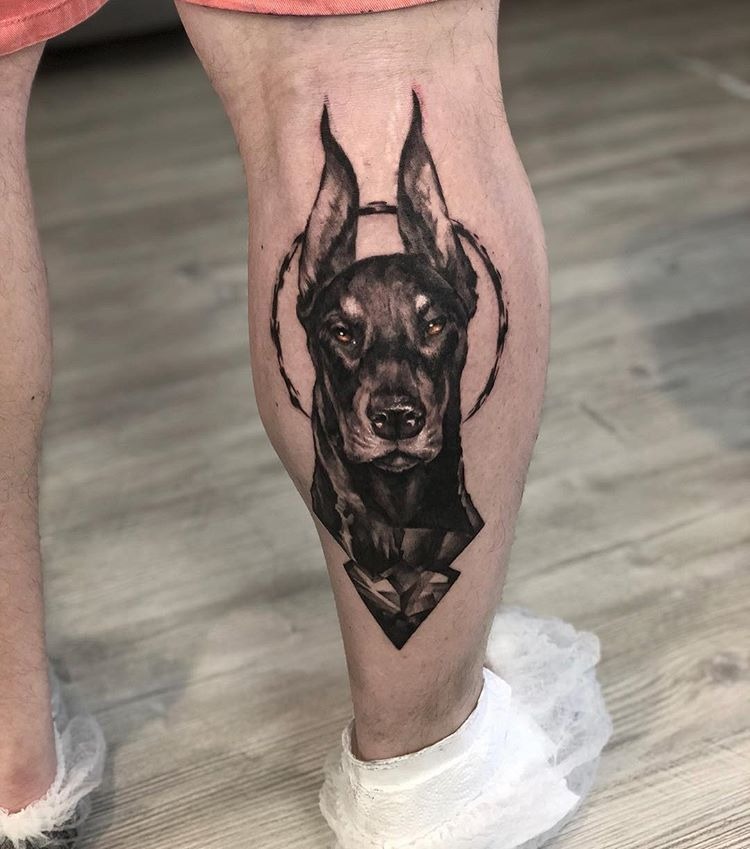 Halo-Framed Realistic Calf Portrait Tattoo Design