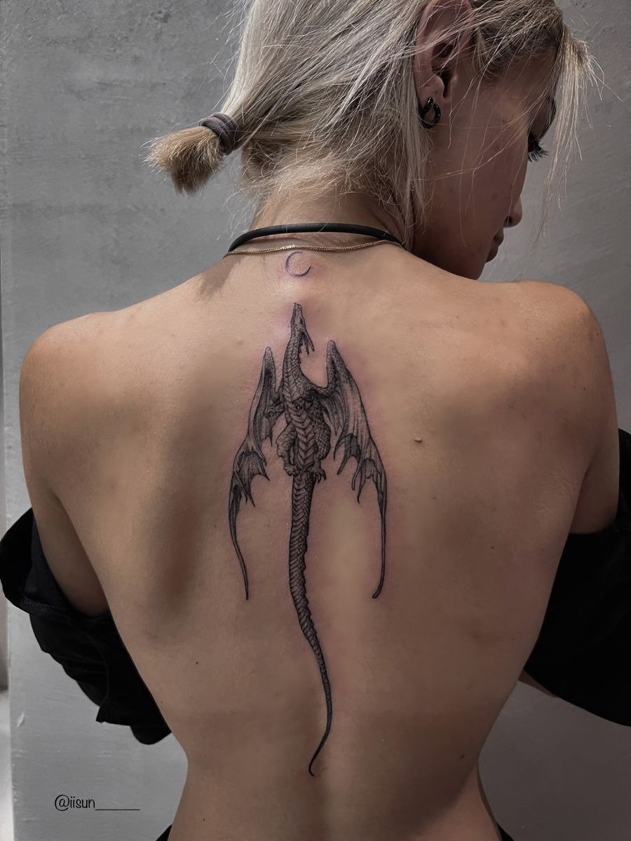 Minimal Spine Dragon with Subtle Wings, a tattoo design rendered in delicate fine-line for the back.