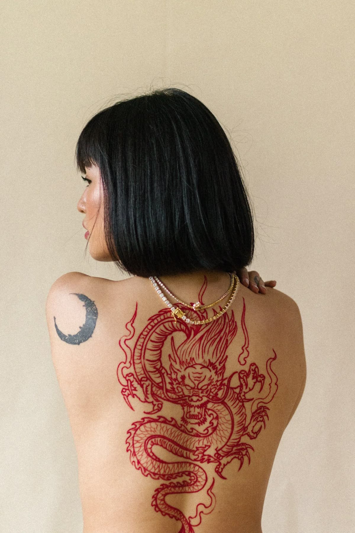 Red Chinese Dragon with Fire Energy, a tattoo design rendered in clean detailed linework for the back.