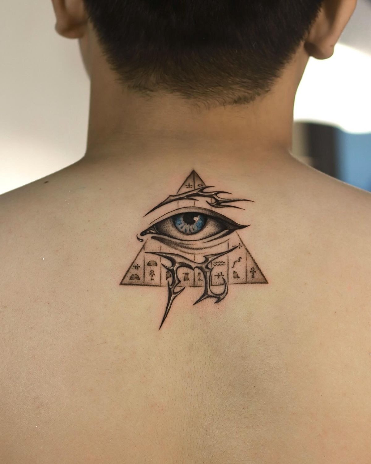Blue-Eyed Pyramid Eye Back Tattoo Tattoo Design