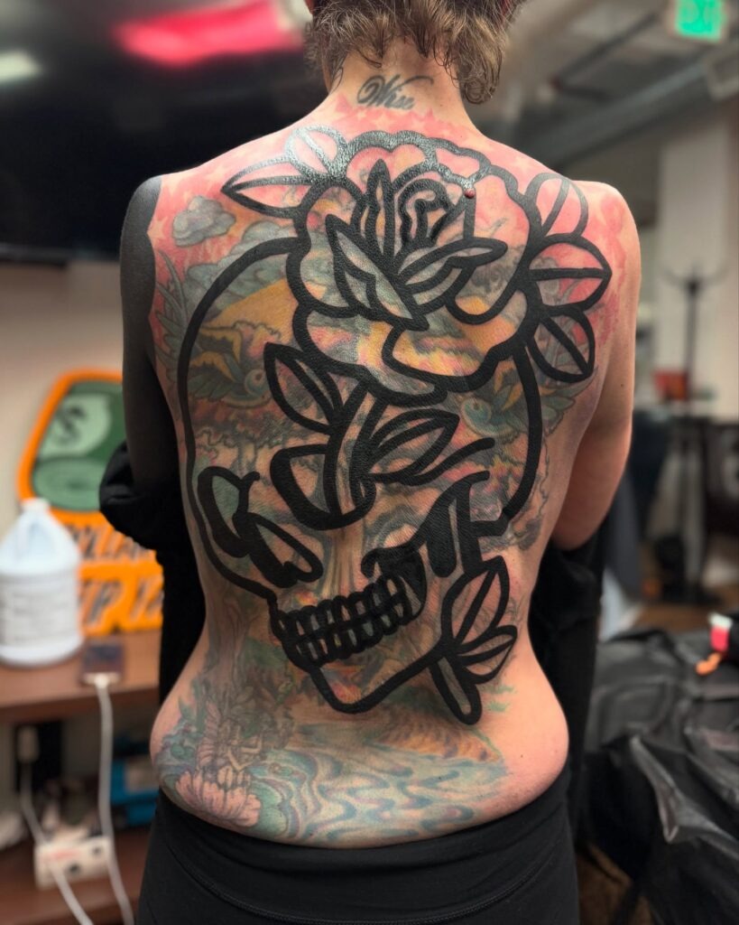 Bold Skull and Rose Blast Over Back Tattoo Tattoo Design