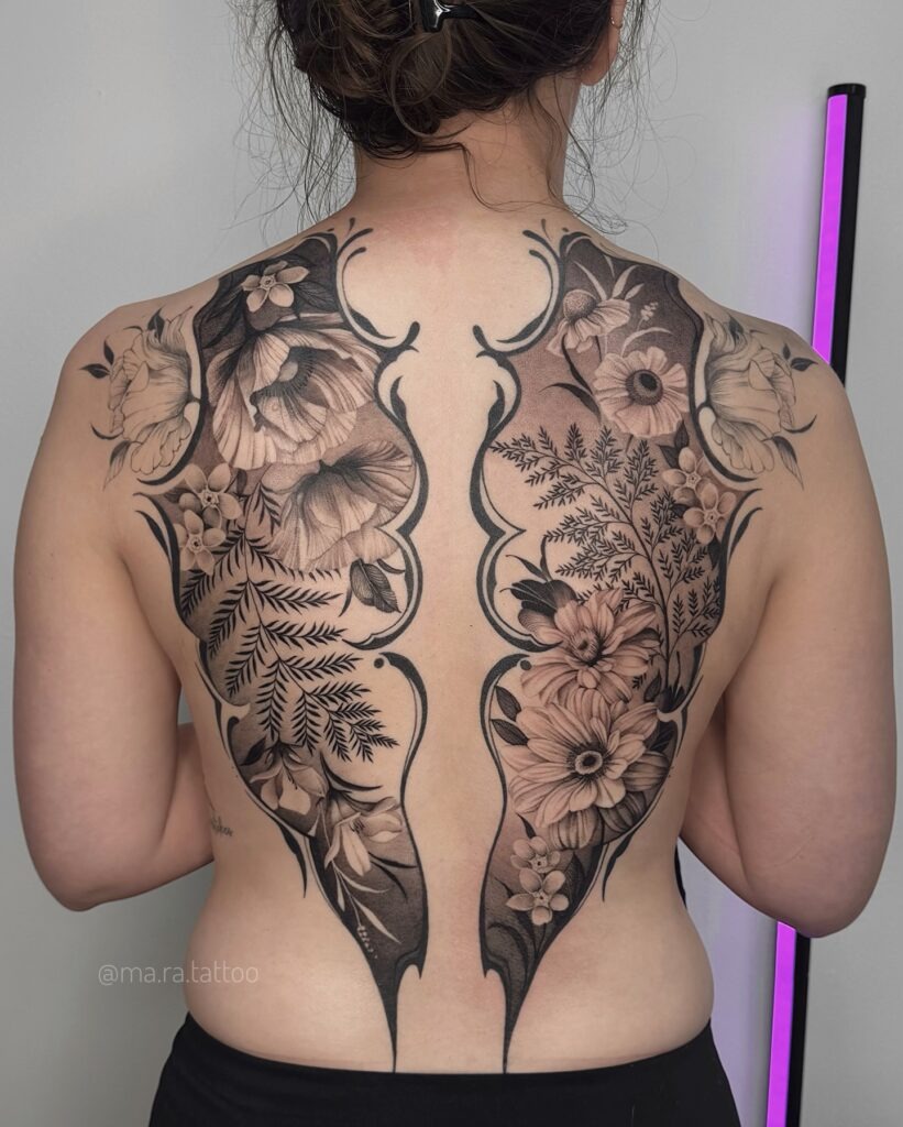 Elegant Back Tattoo with Botanical Symmetry and Deep Shading Tattoo Design