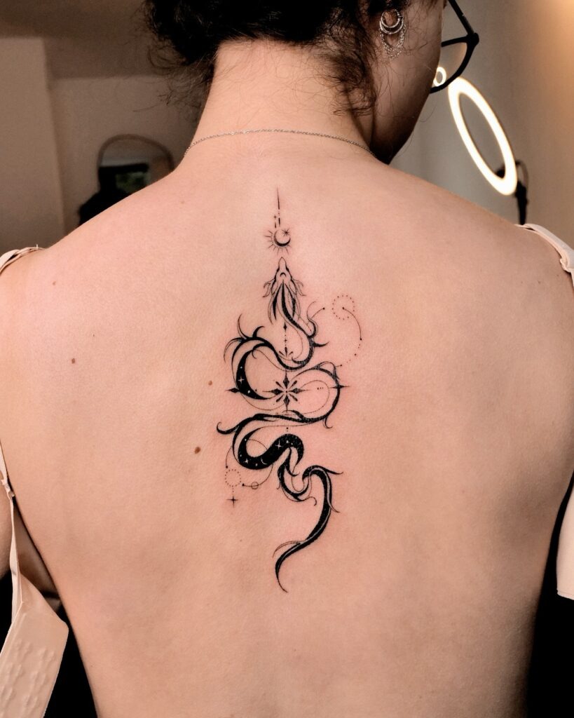 Elegant Ornamental Spine Tattoo with Celestial Touches Tattoo Design