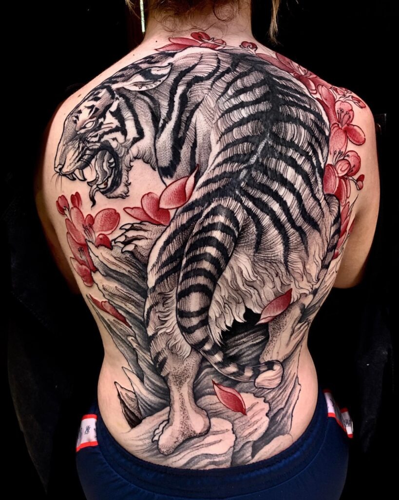 Ferocious Tiger Back Tattoo with Red Blossoms Tattoo Design